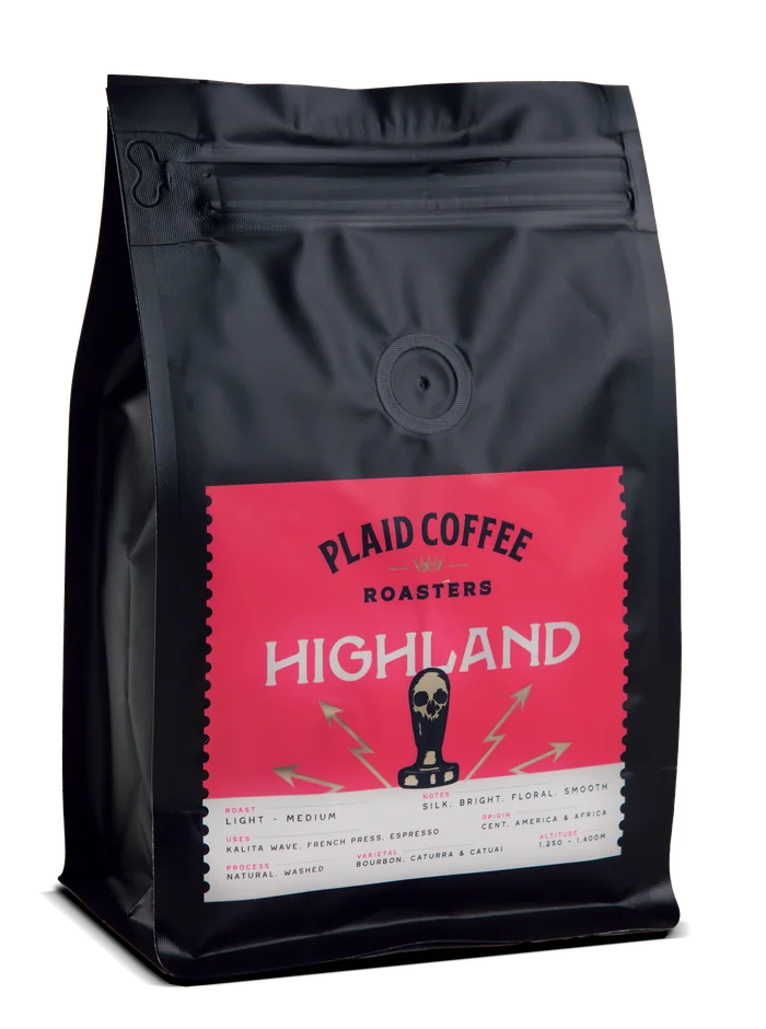 Plaid Coffee Highland roast bag, matte black with a coral label and Scottish thistle illustration